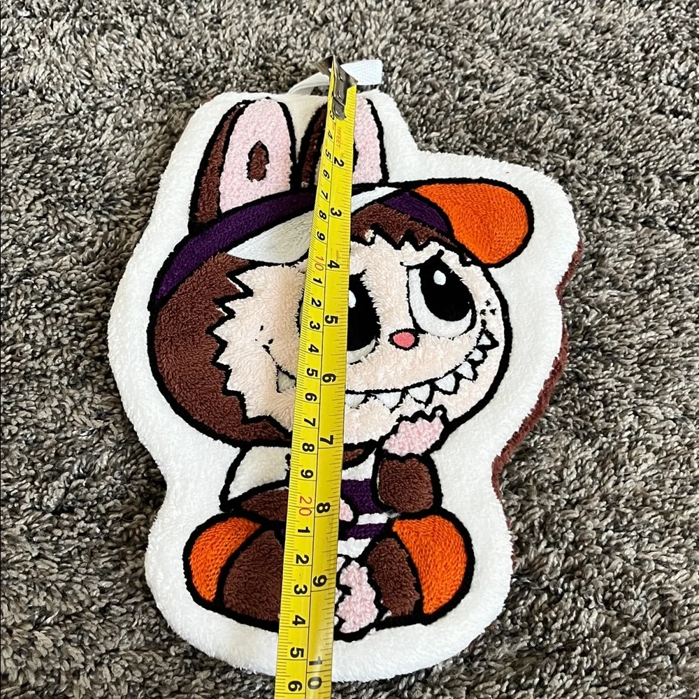 Monster soft wash towel. Has a holder at top. New. No tags.